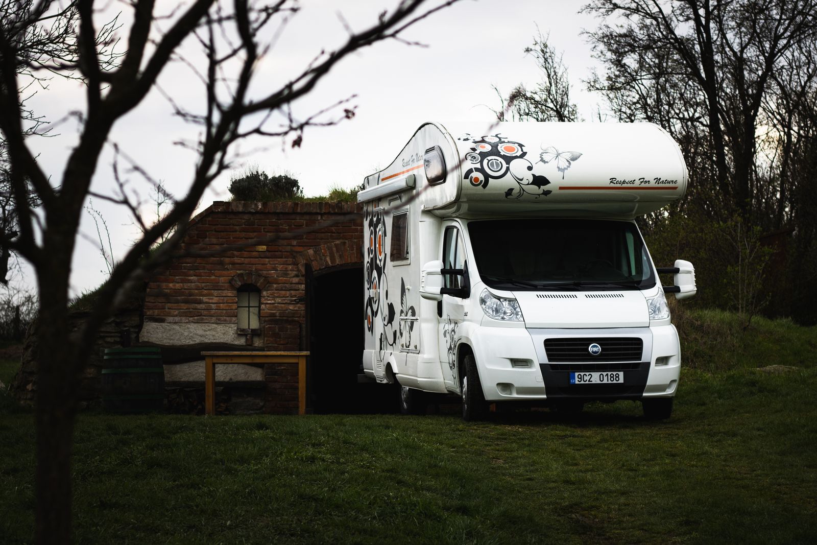 Compact Class C camper parked in the countryside