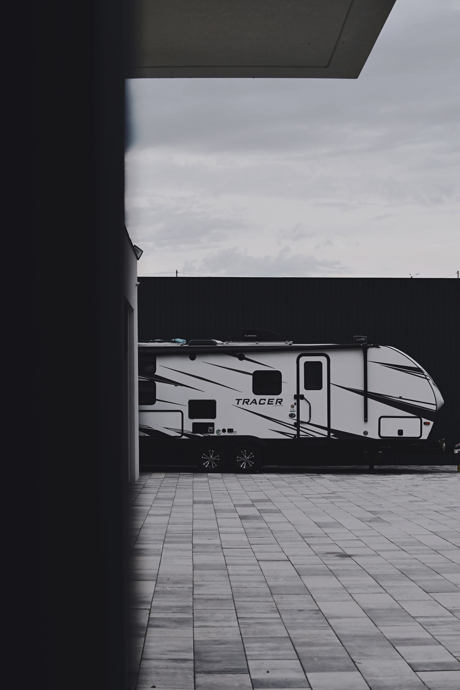 Modern travel trailer with graphics package at the dealership